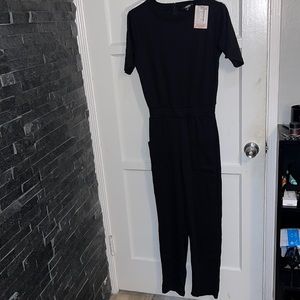Miss guided jumpsuit zip in back USA size 6 tall with front pockets with tags
